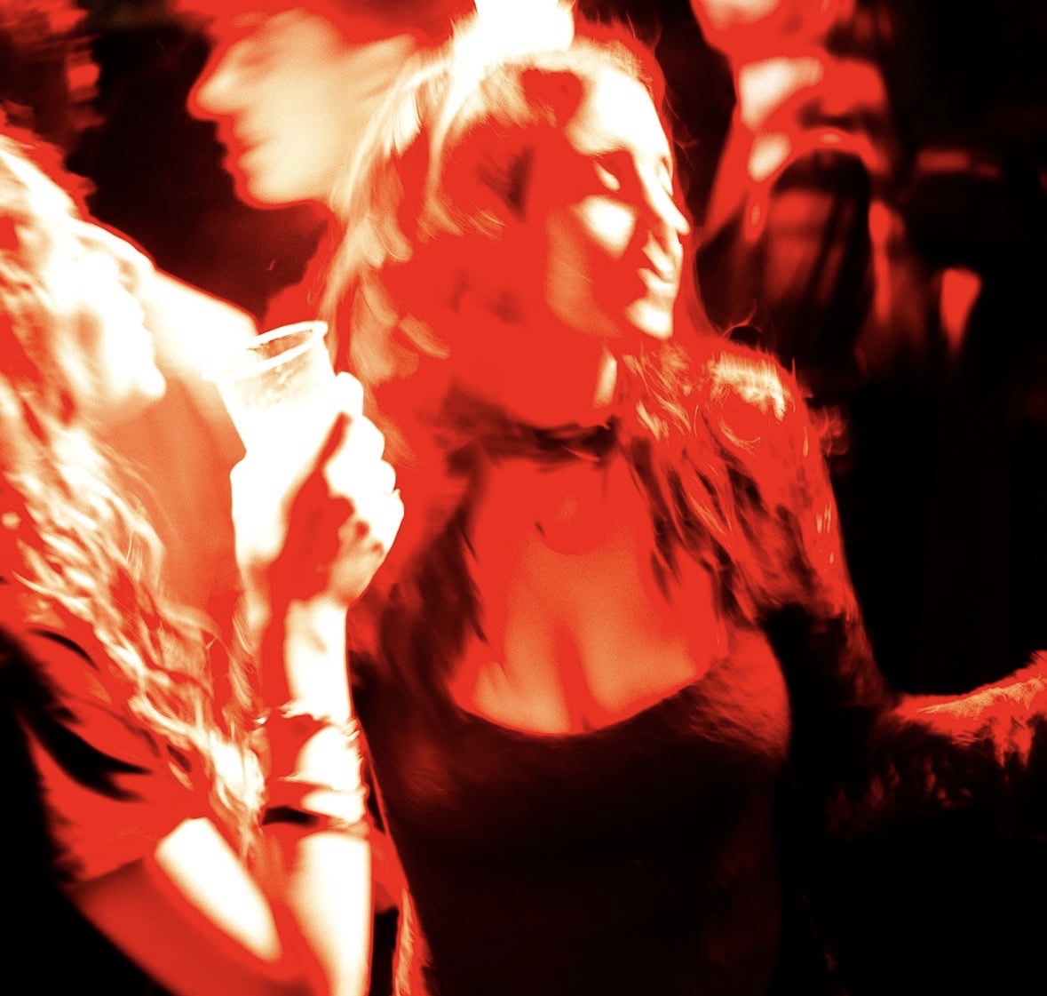 Dancers lit in deep red